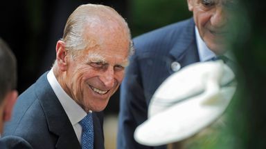 FILE - In a July 6, 2010 file photo, Prince Phillip, the Duke of Edinburgh, is greeted during his visit to the British Garden at Hanover Square in New York. Prince Philip celebrated his 90th birthday Friday, June 10, 2011 in apparent good health and good humor but announced plans to cut back his officials duties.   (AP Photo/Henny Ray Abrams, Pool, File)